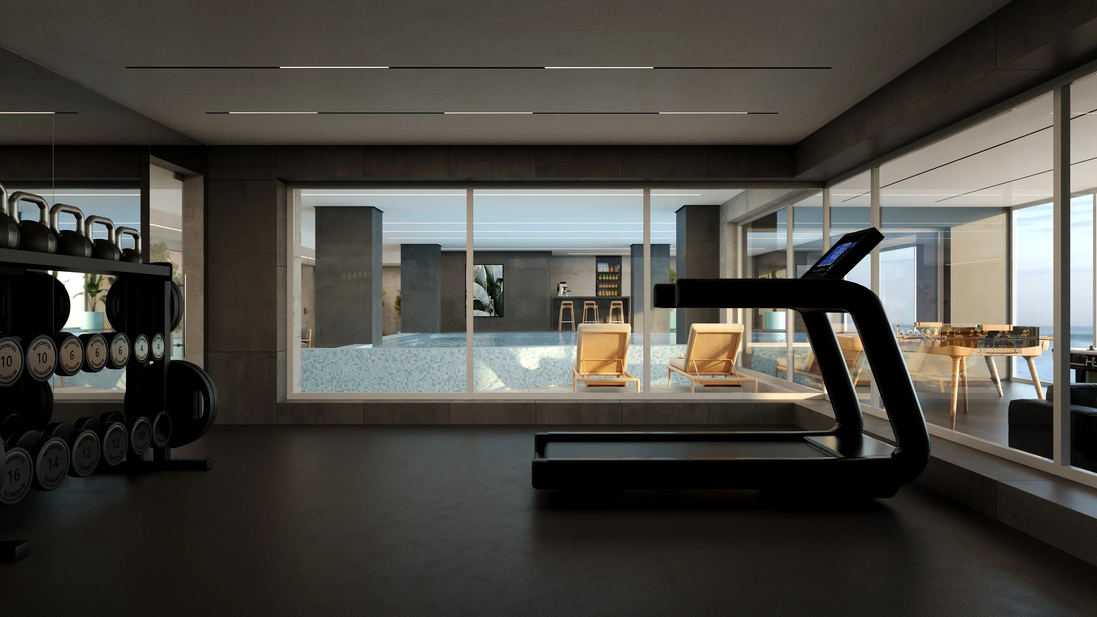 Fitness suite opening onto the pool deck with the sea beyond